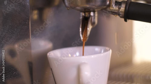Close-Up Coffee Machine Pour Espresso In White Cup. Process Of Making