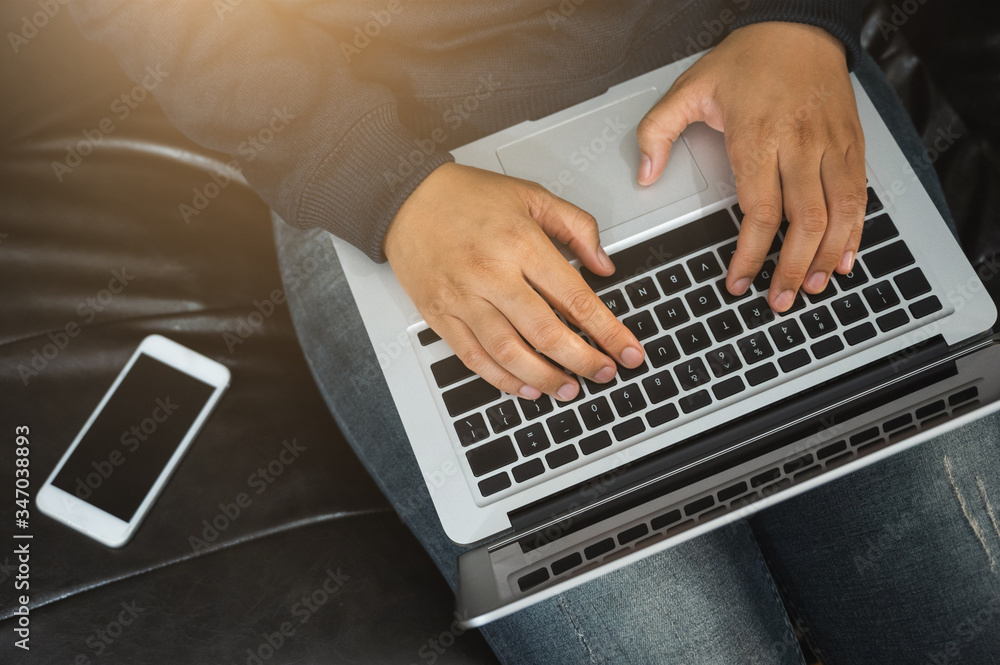 Close up female hands using laptop work from home on sofa. Close up female hands using laptop work from home on sofa.