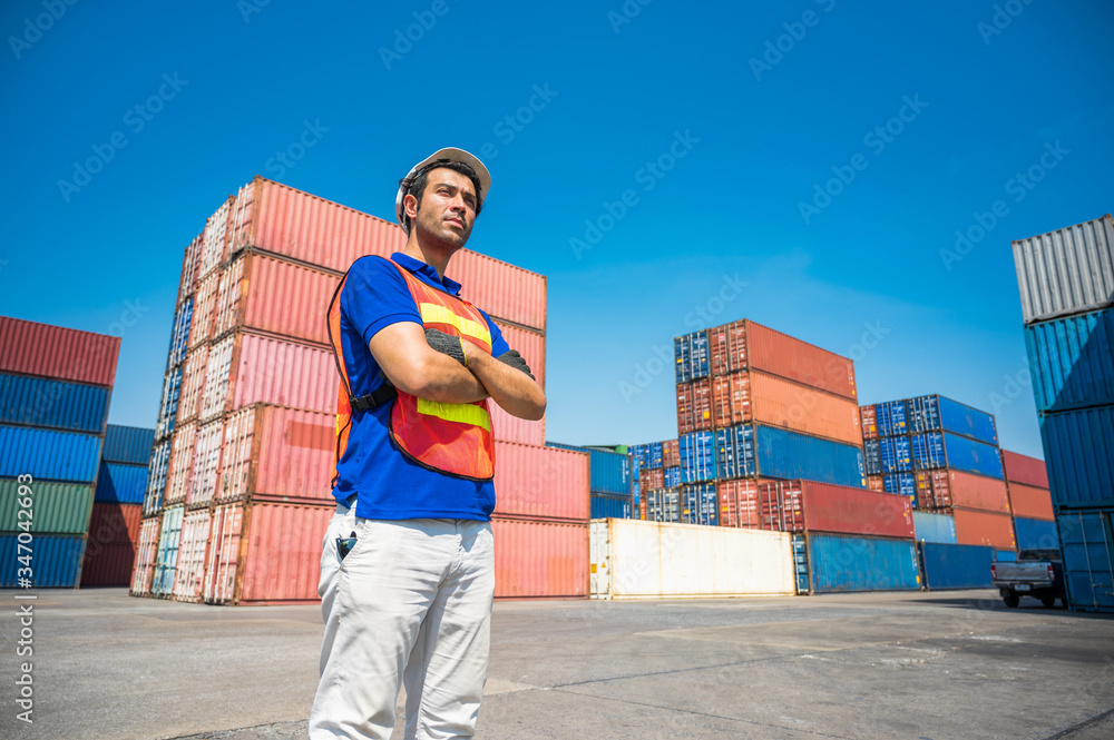 Foreman working at Container cargo harbor. Business Logistics import export shipping concept. Foreman working at Container cargo harbor. Business Logistics import export shipping concept.