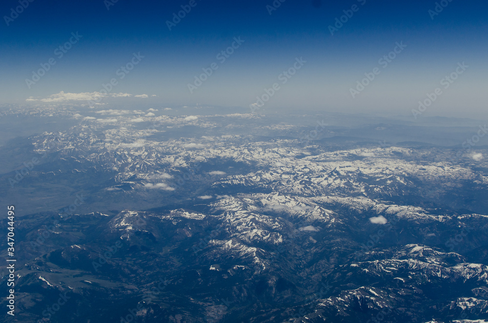 Aerial View Of Landscape Against Blue Sky