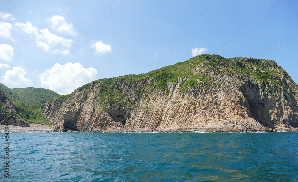 Naklejka premium Huge hexagonal columnar joints of volcanic rock at Hong Kong Global Geopark, China 