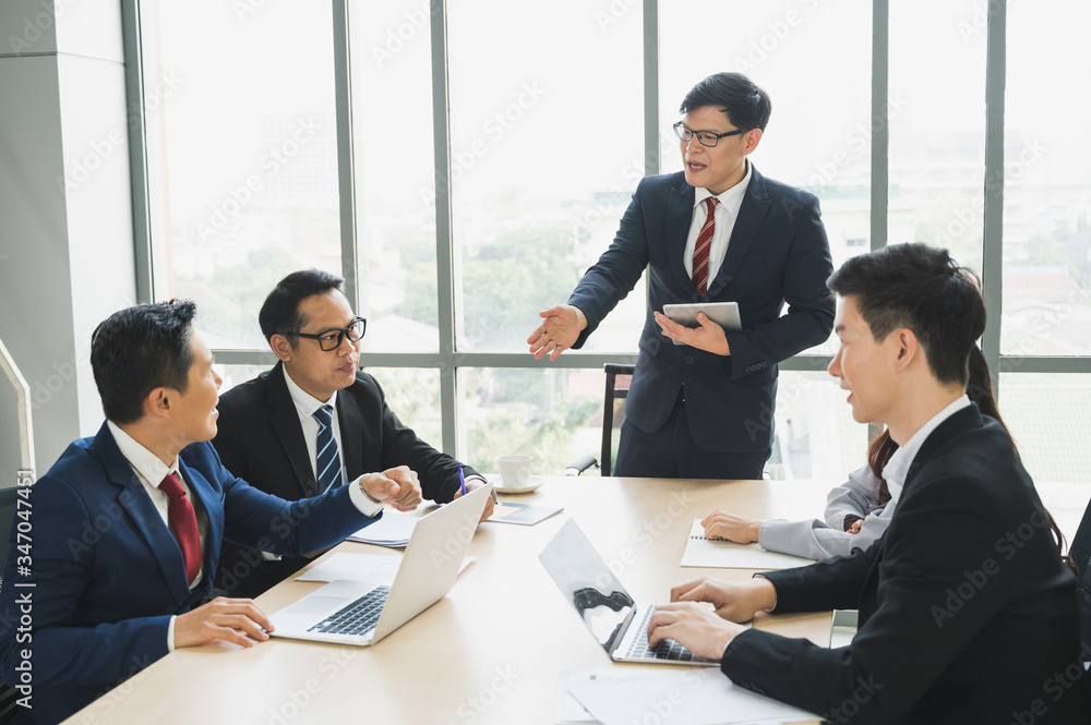 Asian business people team analyzing statistics financial. Team of businesspeople Meeting Conference Discussion Corporate Concept in office. Asian business people team analyzing statistics financial. Team of businesspeople Meeting Conference Discussion Corporate Concept in office.