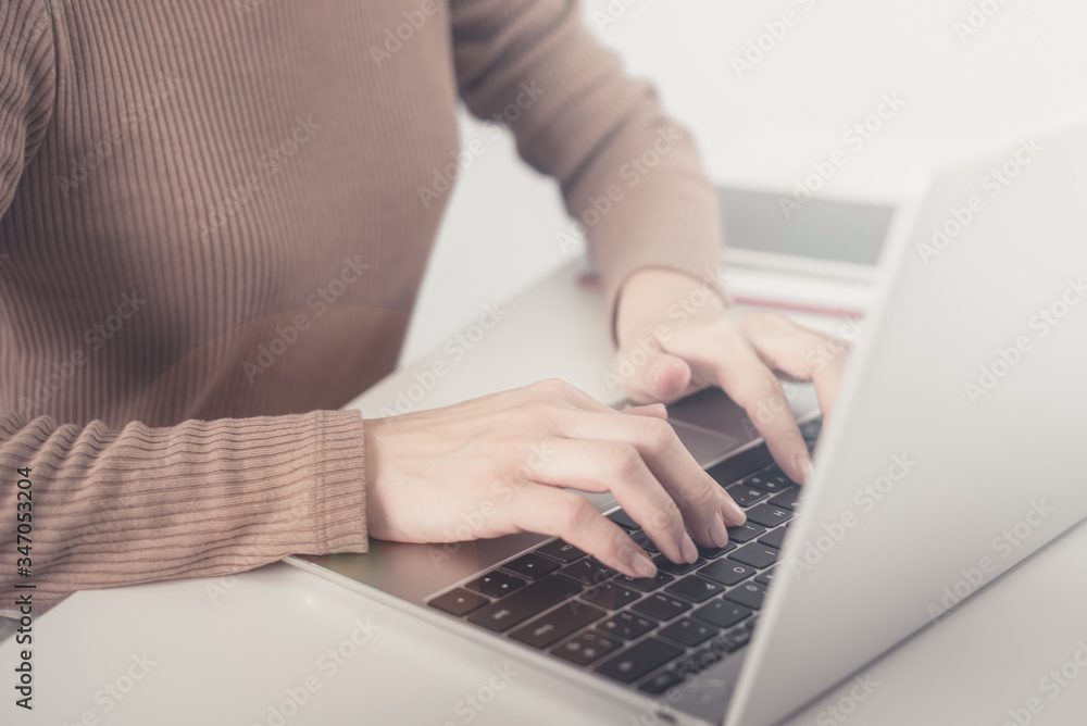 businesswoman working on white desk with laptop, pad, smartphone at office look very busy. work from home concept businesswoman working on white desk with laptop, pad, smartphone at office look very busy. work from home concept