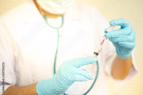 Syringe medical injection in hand holding with medicine dose vaccination equipment with needle.