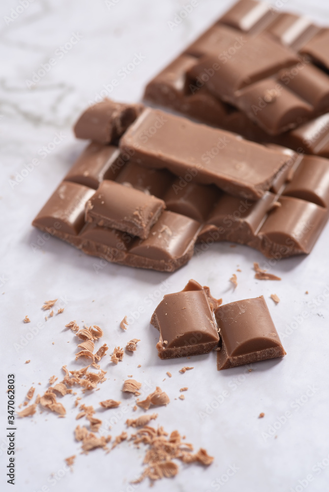 Delicious and tasty milk chocolate bar on a white background Delicious and tasty milk chocolate bar on a white background