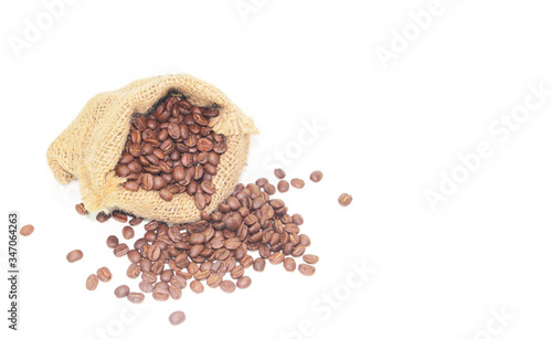 Coffee beans in a sack bag on white background