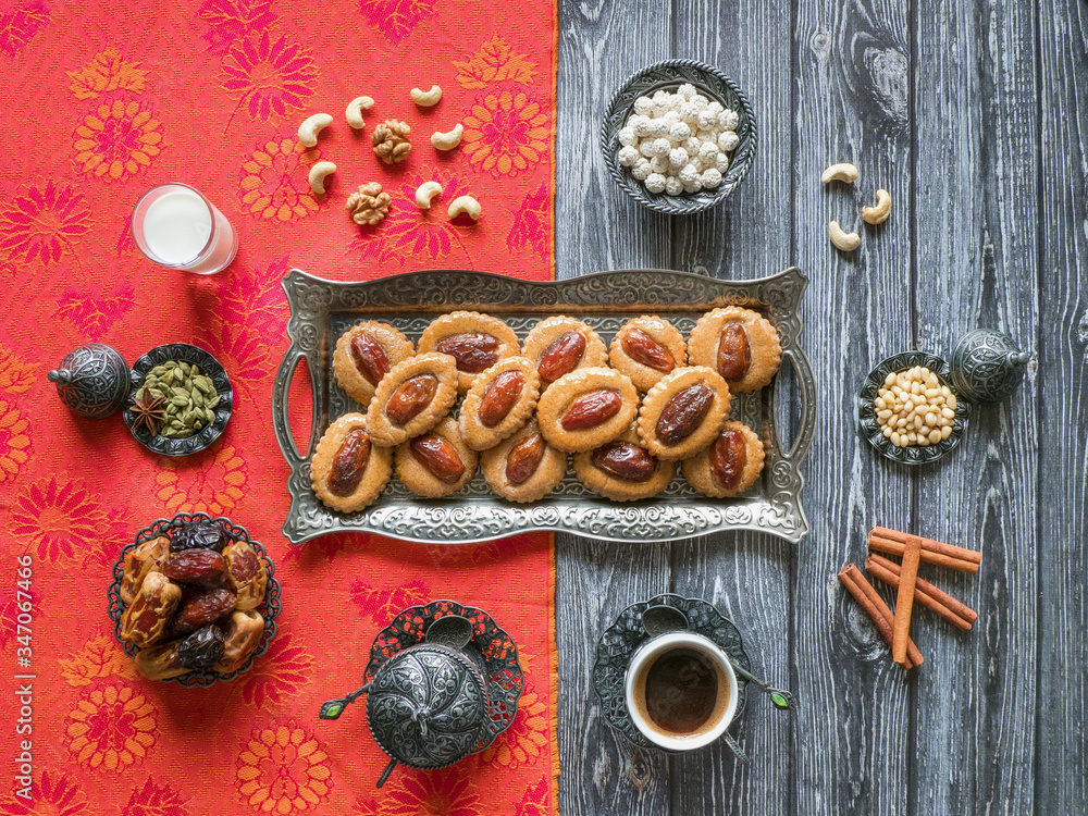 Homemade Eid Dates sweets on a black wood background Homemade Eid Dates sweets on a black wood background