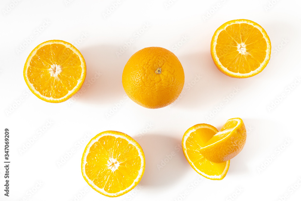 two whole and sliced orange on a white background top view two whole and sliced orange on a white background top view