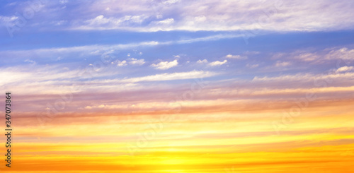 Color line light in twilight sky with soft clouds