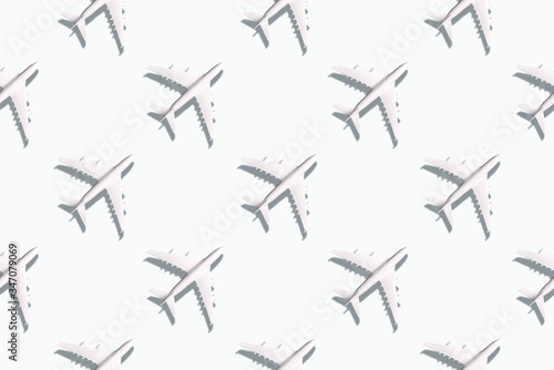 Summer pattern. Creative banner of planes on white background. Travel, vacation concept. Travel, vacation ban. Flights cancelled and resumed again. Top view. Flat lay. Minimal style design.