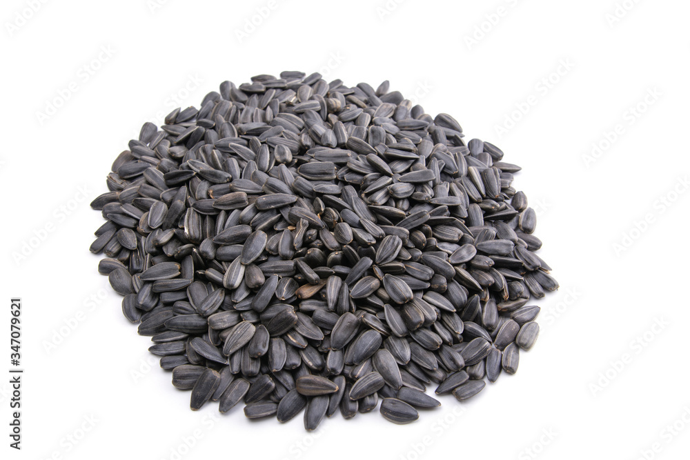 fried sunflower seeds on a white isolated background fried sunflower seeds on a white isolated background
