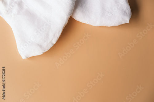 homemade cloth masks for protection against coronavirus (COVID-19) on brown background medium shot