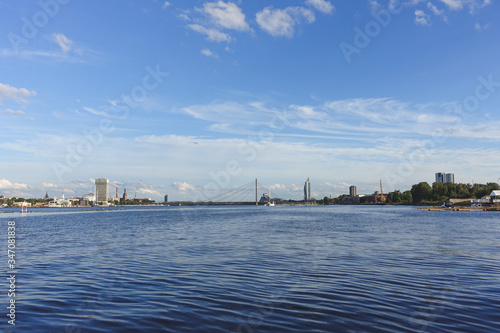 View across the river Daugava to the cable-stayed bridge and the city on the opposite bank, Riga, Latvia © Dainis