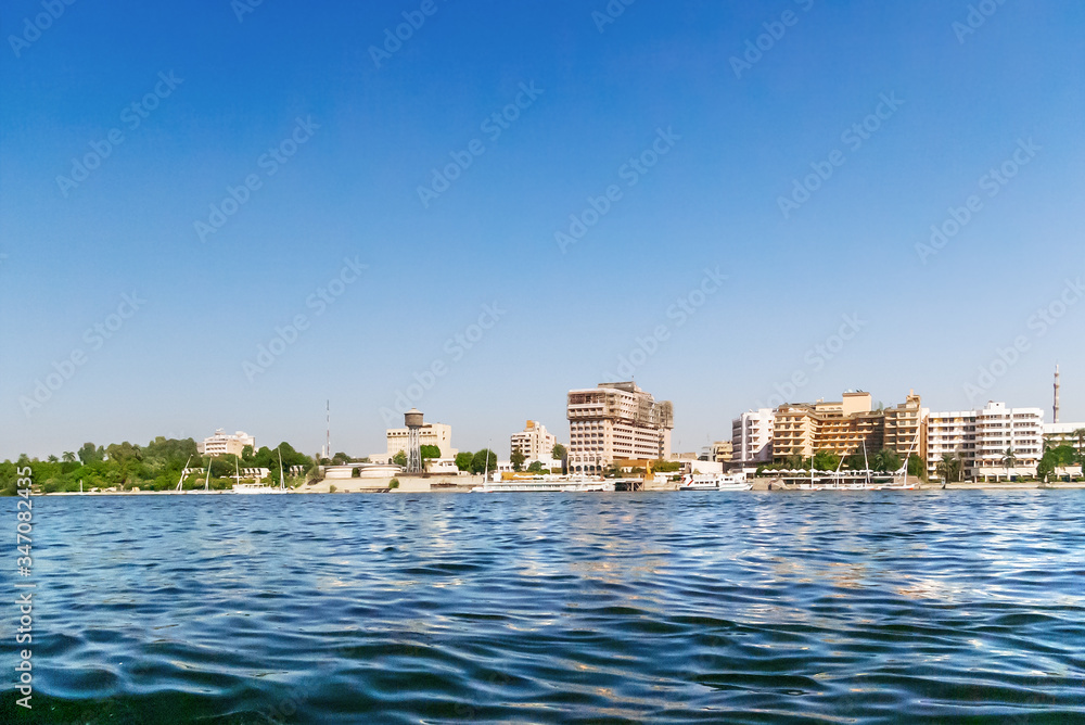 Hotels under construction on the banks of the Nile river. Construction sites of new buildings for touristic business in Cairo, Egypt.