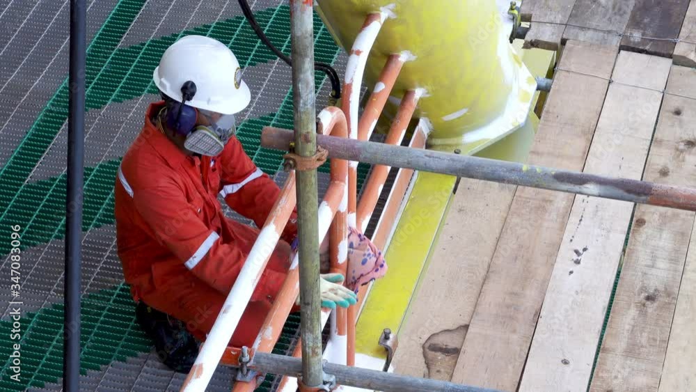 4K realtime footage of industry workers with full Personal protective