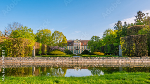 Abbots Palace in the rococo style and located in Oliwa Park in spring scenery.