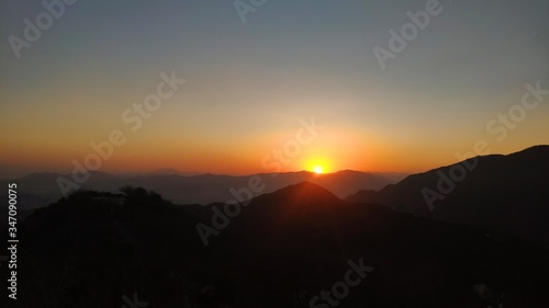 sunset over the mountains © 朝洋 李