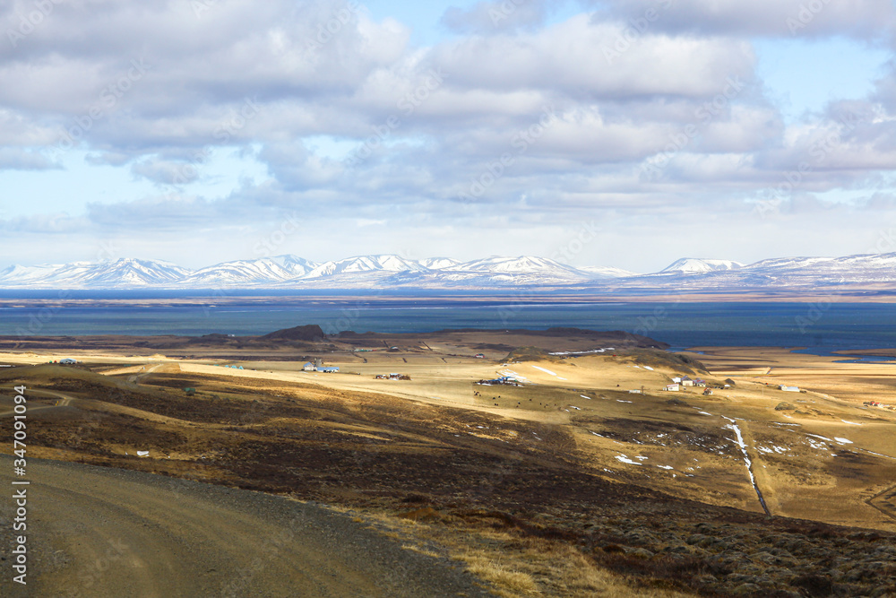 the ocean Bay in the beautiful snowy mountains. The Landscape Of Iceland