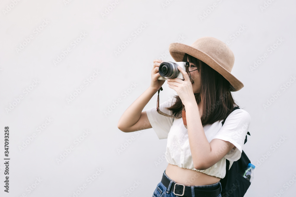 Young asian cute glasses girl hipster style travel with camera.