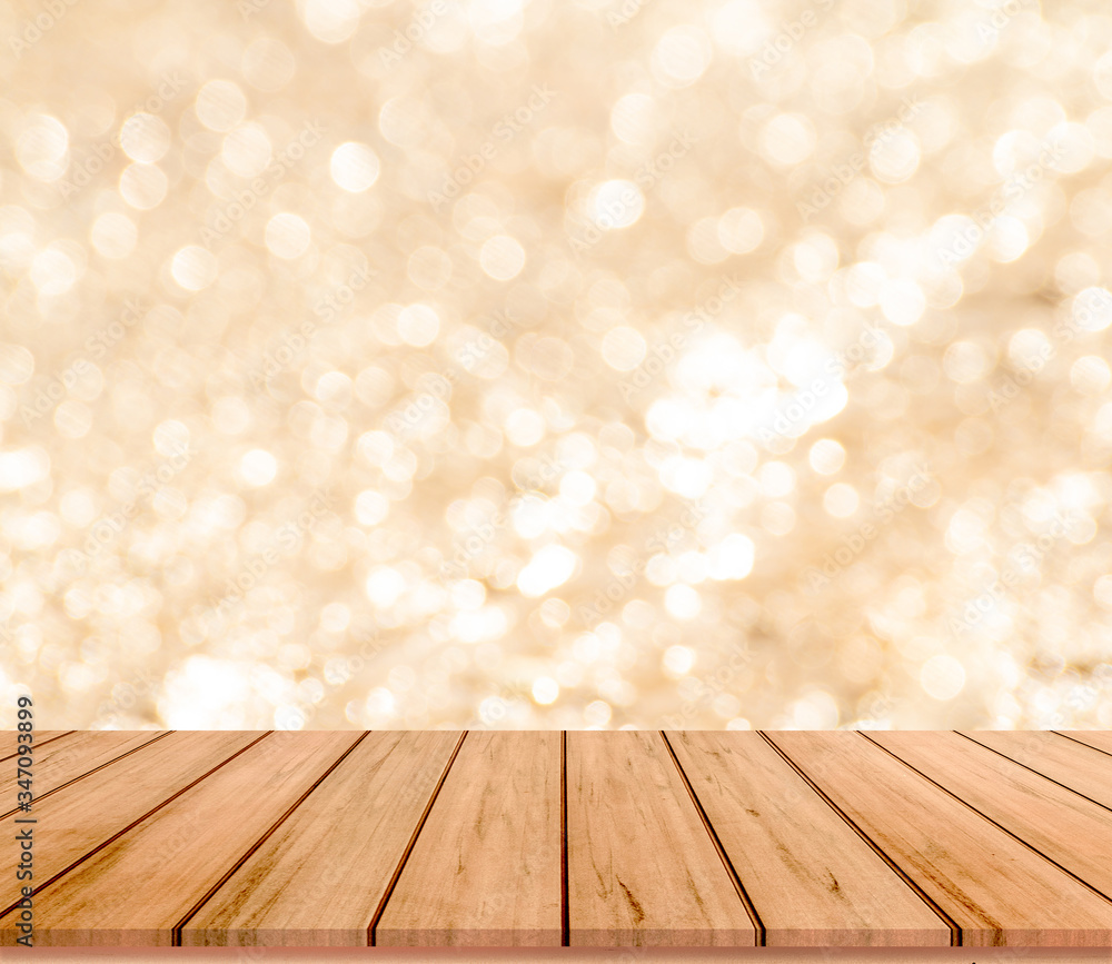 empty wooden table with gold bokeh background empty wooden table with gold bokeh background