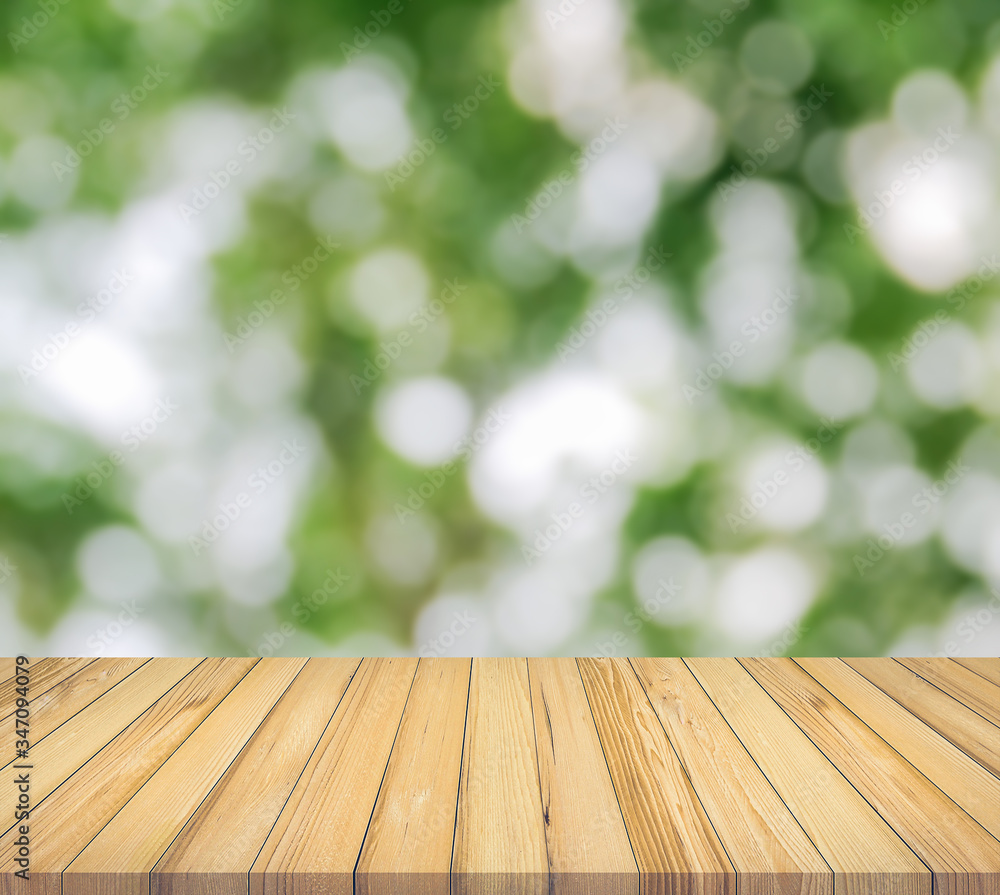 wooden table on green bokeh background wooden table on green bokeh background