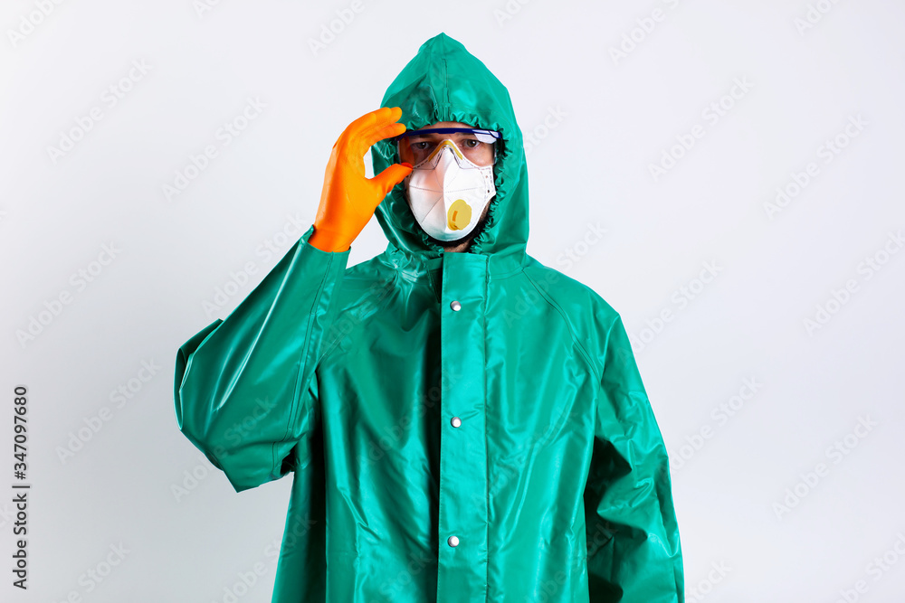 Person in impermeable clothes looking ready to work in infected places Person in impermeable clothes looking ready to work in infected places