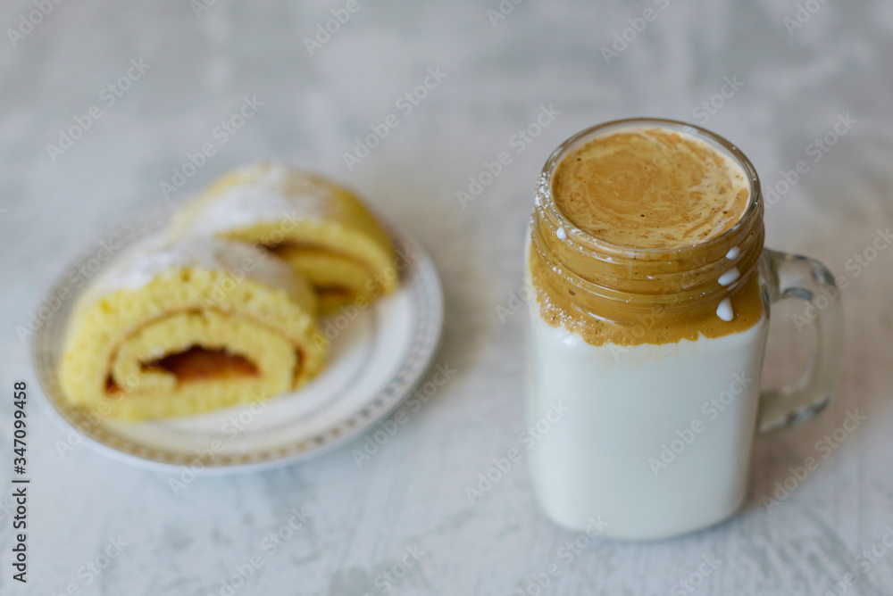 dalgona coffee and homemade biscuit on a light marble background dalgona coffee and homemade biscuit on a light marble background