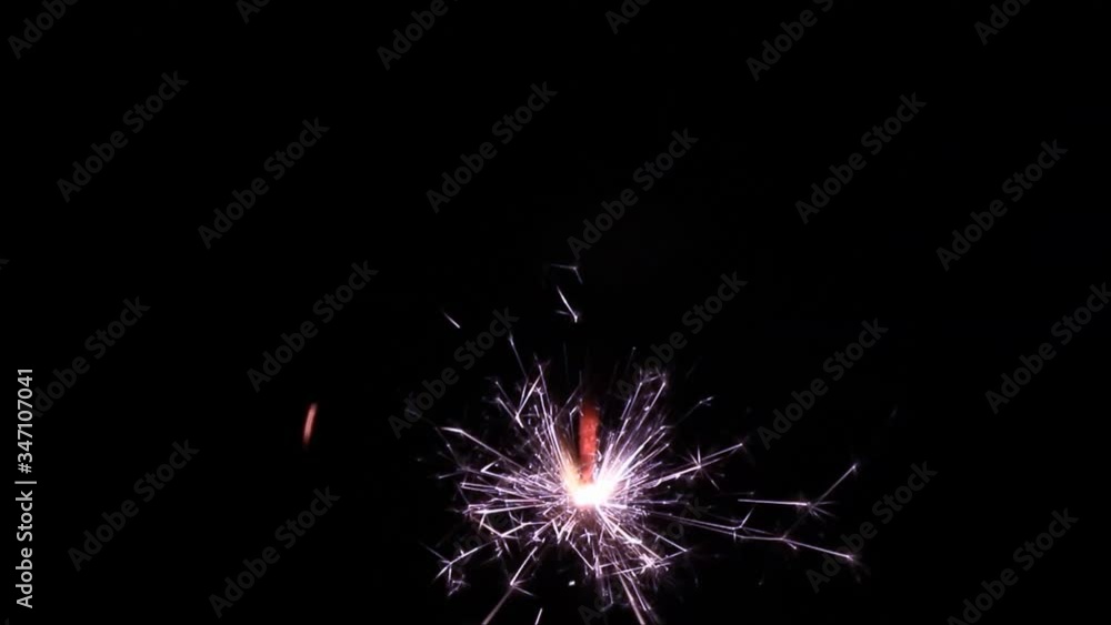 sparkler burning on black
sparkler burning on black