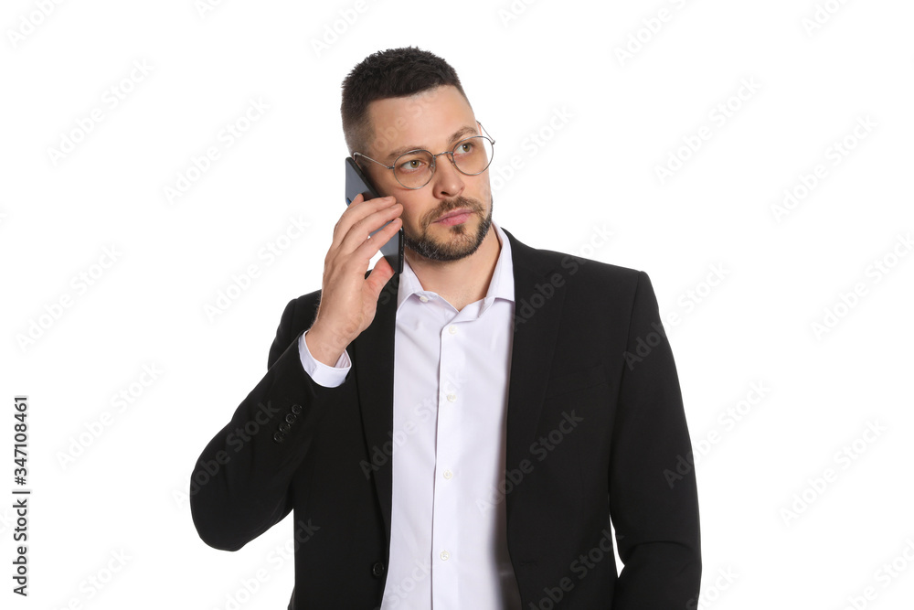Businessman in glasses talking on smartphone against white background Businessman in glasses talking on smartphone against white background
