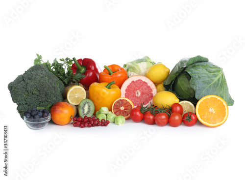 Fresh products rich in vitamin C on white background