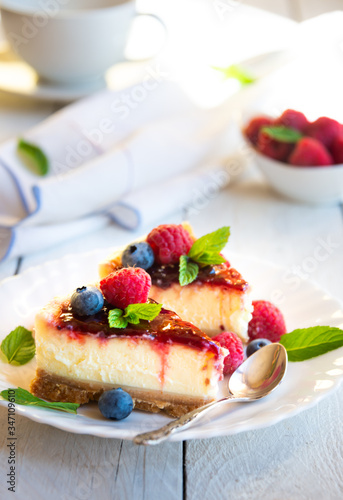 Homemade delicious cheesecake with fresh fruit and mint