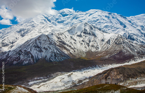 Expedition in snowy mountains. Scenic landscape. Beautiful nature. Mountain peaks.