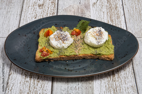 Toast with avocado and egg.