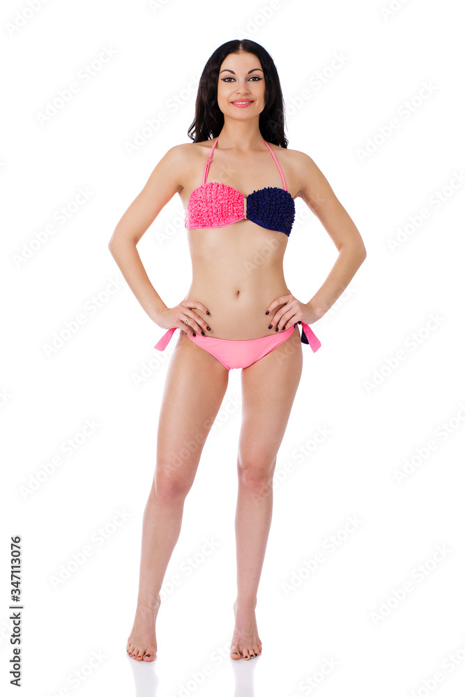 Full length beautiful slim tanned woman in bikini, isolated on white background Full length beautiful slim tanned woman in bikini, isolated on white background
