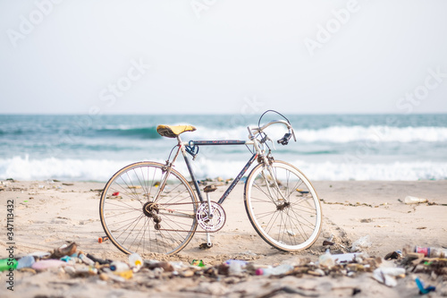 Road bike at the polluted beach