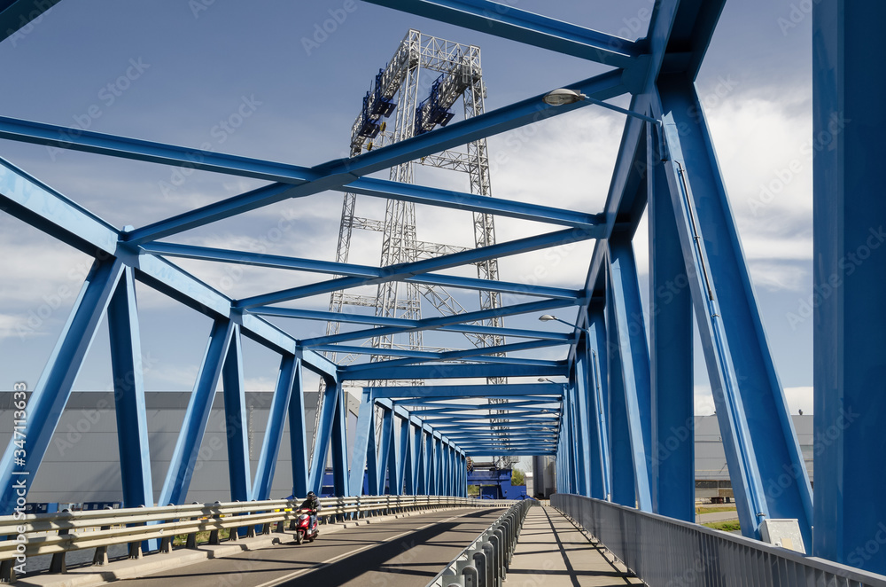 Naklejka premium BRIDGE - Picturesque classic steel structure on the river 