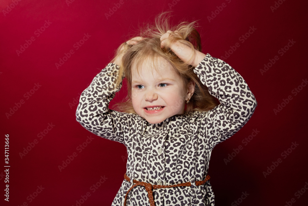 portrait of a girl on a red background, bright emotion, the girl is angry and regret on her face