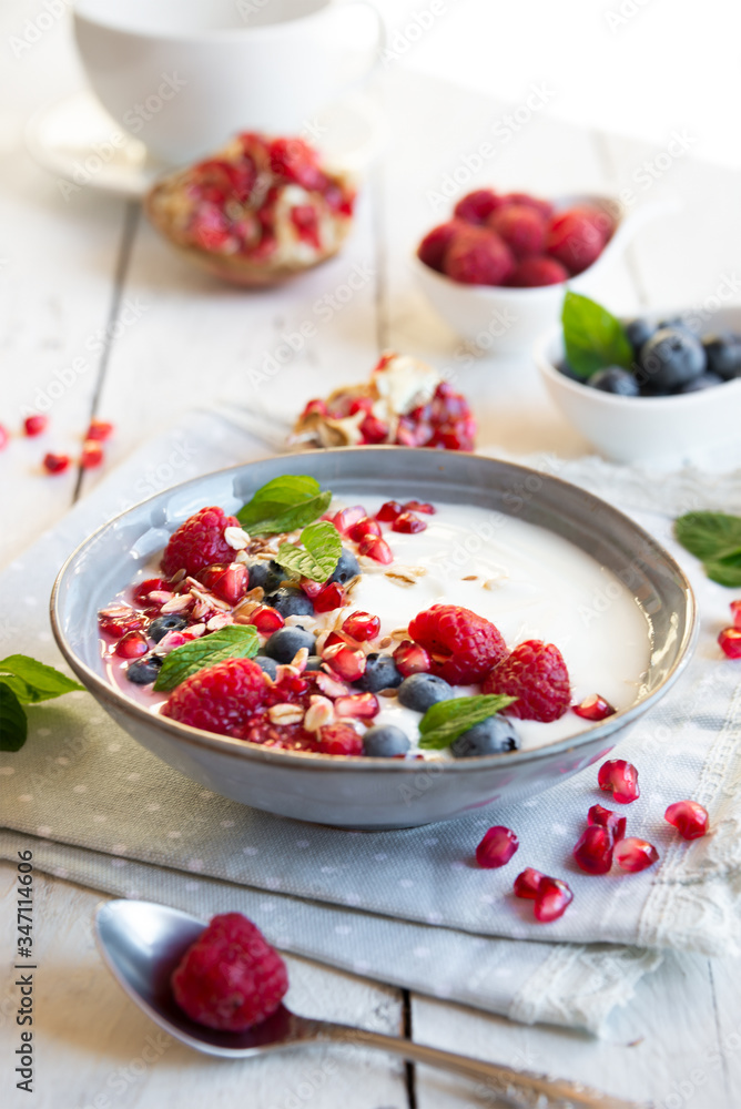 Yogurt with fresh fruit and cereals in a bowl, healthy breakfast Yogurt with fresh fruit and cereals in a bowl, healthy breakfast