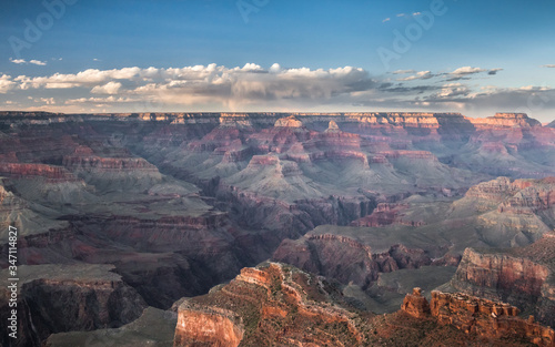 Sunset over grand canyon national park with distant clouds