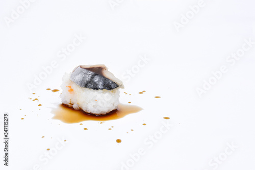 Sushi on white background and soy sauce, Sushi rolls japanese food isolated on white background. California Sushi roll with tuna, vegetables and unagi sauce closeup. Japan restaurant menu.