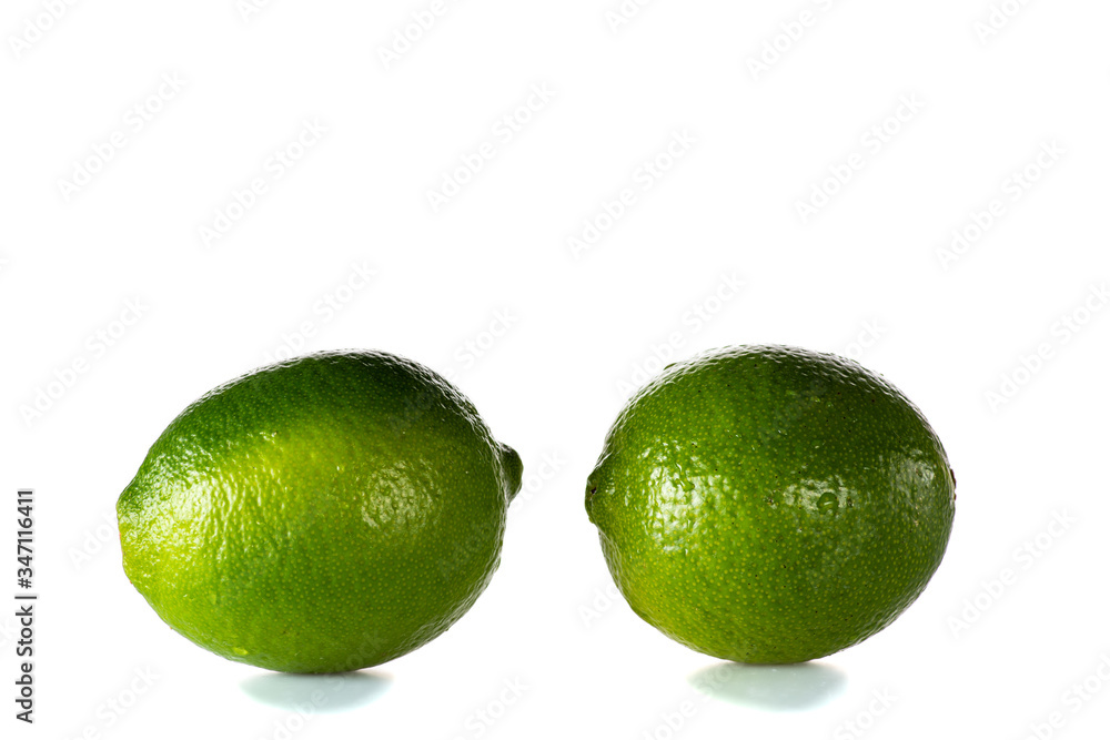 clean washed lime with drops of water on a black or white background isolated clean washed lime with drops of water on a black or white background isolated