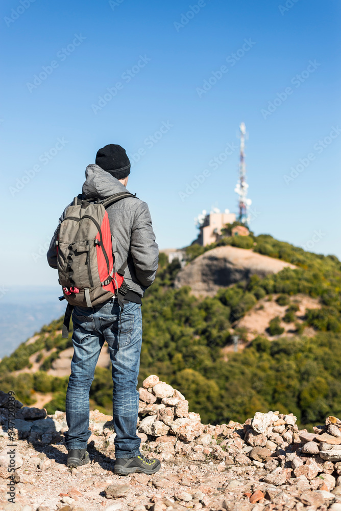 Mountaineer in the summit of a mountain