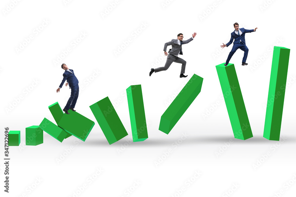 Business people in a collapsing economy concept Business people in a collapsing economy concept