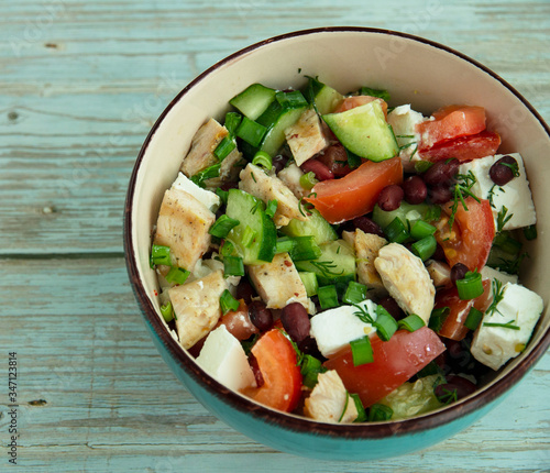 Salad with chicken, vegetables and brine cheese