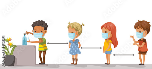 Social distancing. Children at school keep distance away. Boys and girls wearing masks and using alcohol gel. Coronovirus epidemic.  protective equipment. Society people to protect from COVID-19. 