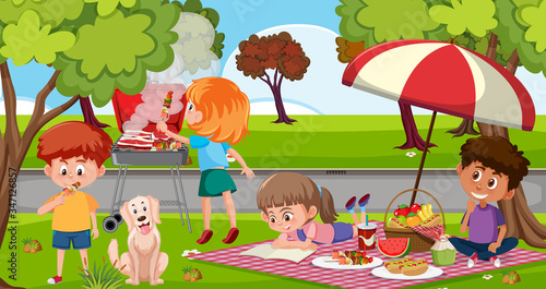 Scene with happy children eating in the park