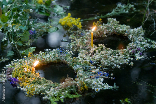 Fotografija Ivan Kupala traditions - Wreath with candle on water