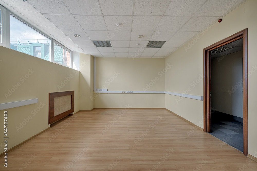 Fototapeta premium Empty office space in an office building. Concept: bankruptcy, economic crisis