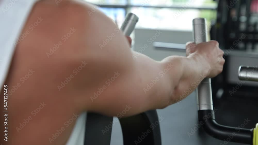The girl goes in for sports in the gym. The girl goes in for sports in the gym.