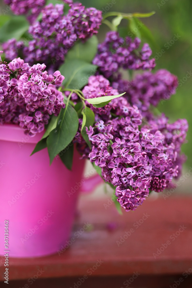 Lilac bouquet in a pink bucket. Romance Lilac bouquet in a pink bucket. Romance